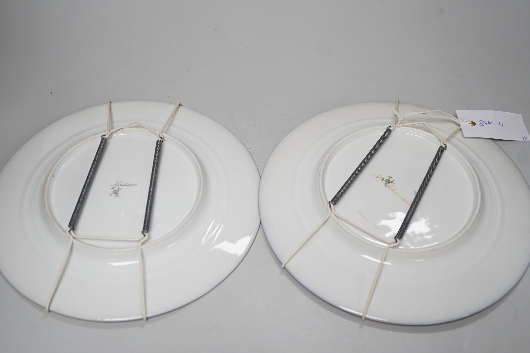 A pair of Pirkenhammer gilt and portrait painted cabinet plates, 25cm diameter